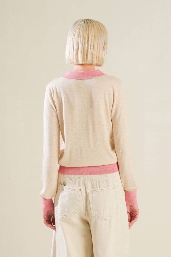A solid sweater knit polo