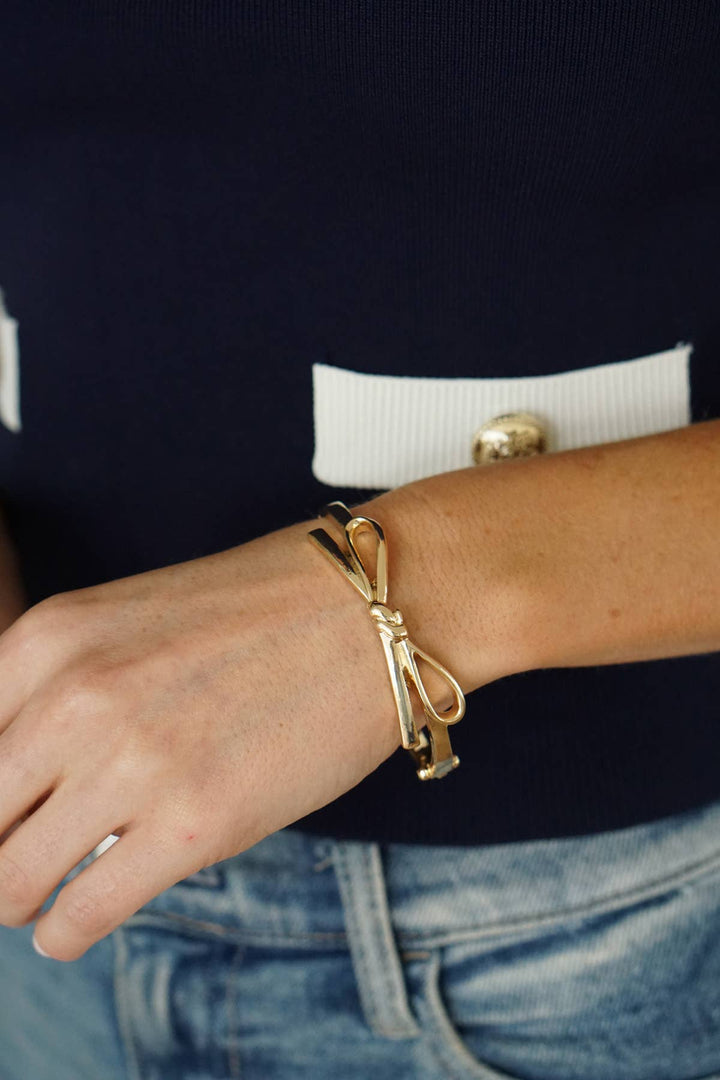Karina Bow Wrapped Hinge Bangle in Shiny Gold - Marie Claire's House of Style 